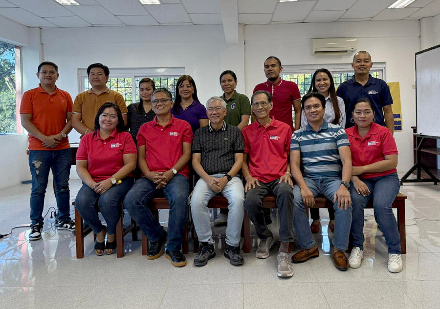 The Hawak Kamay Bank team outside the branch